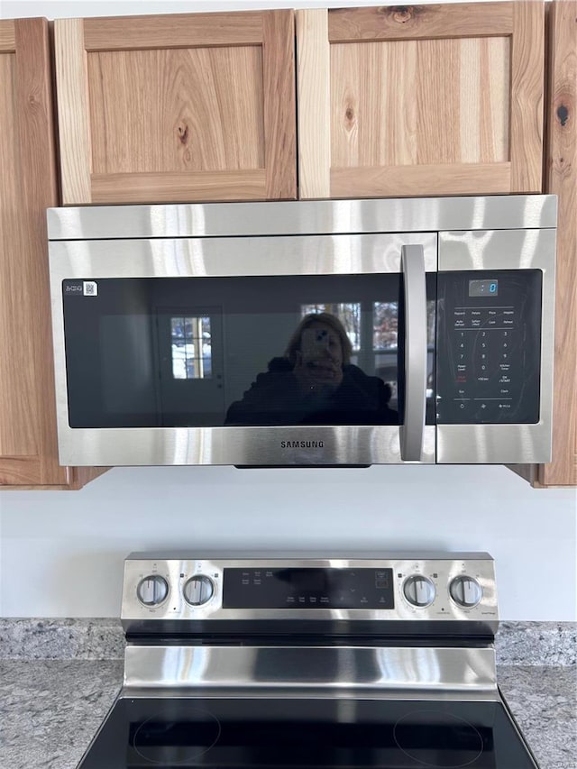 1510 N Mapleshade Rd, Cuba, MO 65453 - kitchen view of stainless steel appliances and light stone counters