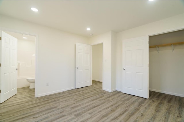 1510 N Mapleshade Rd, Cuba, MO 65453 - unfurnished bedroom featuring wood finished floors, a closet, baseboards, recessed lighting, and ensuite bath