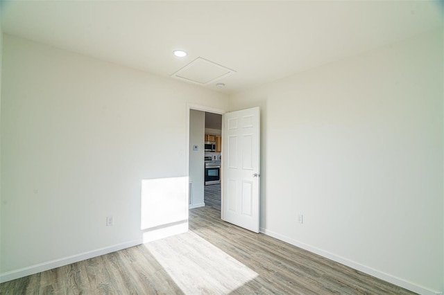 1510 N Mapleshade Rd, Cuba, MO 65453 - unfurnished room with baseboards, light wood-style flooring, and recessed lighting