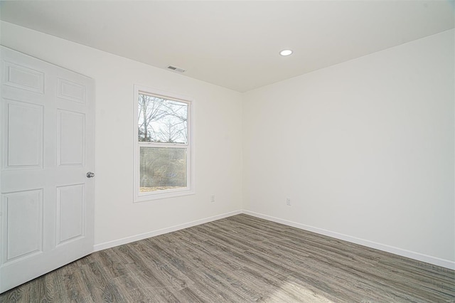 1510 N Mapleshade Rd, Cuba, MO 65453 - spare room featuring wood finished floors, baseboards, and recessed lighting