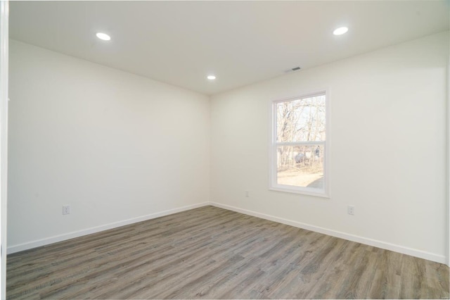 1510 N Mapleshade Rd, Cuba, MO 65453 - unfurnished room featuring wood finished floors, recessed lighting, and baseboards