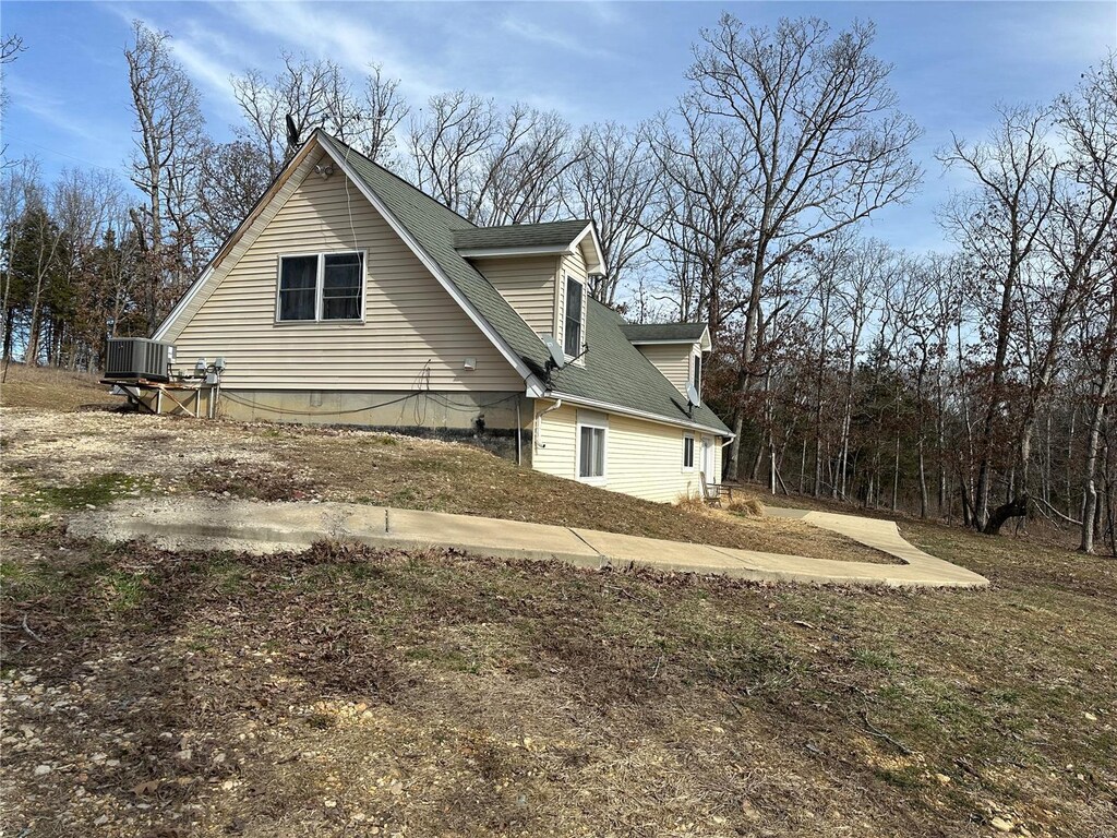 8271 Red Oak Rd, Gerald, MO 63037 - view of home's exterior with central air condition unit and roof with shingles