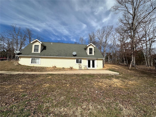 rear view of property featuring french doors and a patio area