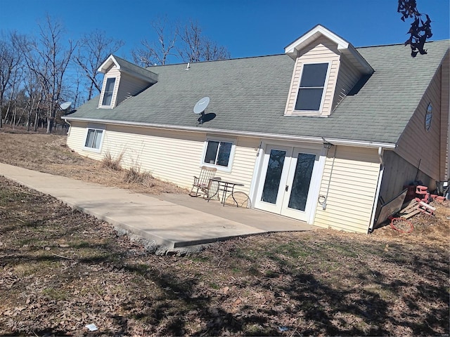 back of property with a patio area and french doors