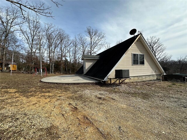 view of side of home with cooling unit