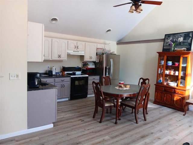 kitchen with black electric range, stainless steel refrigerator with ice dispenser, dark countertops, under cabinet range hood, and ceiling fan