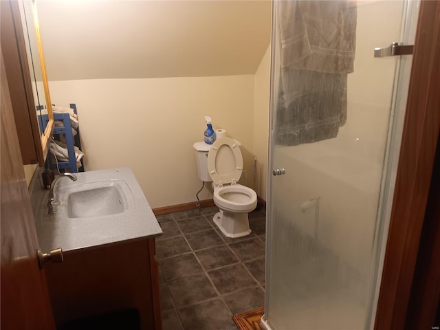 bathroom featuring vanity, a shower stall, toilet, tile patterned flooring, and lofted ceiling