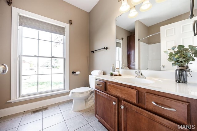 bathroom featuring toilet, tile patterned flooring, baseboards, vanity, and a chandelier