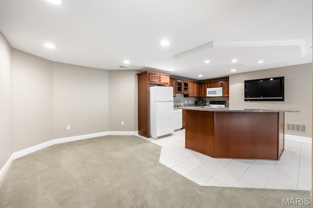 kitchen featuring white appliances, recessed lighting, glass insert cabinets, baseboards, and light carpet