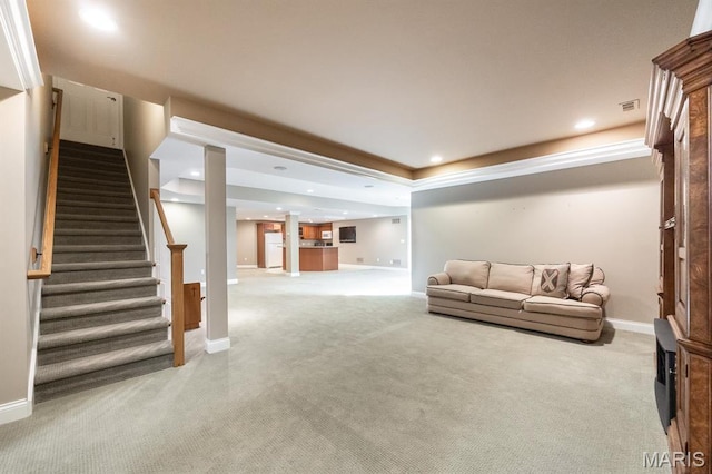 carpeted living room with stairs, baseboards, and recessed lighting