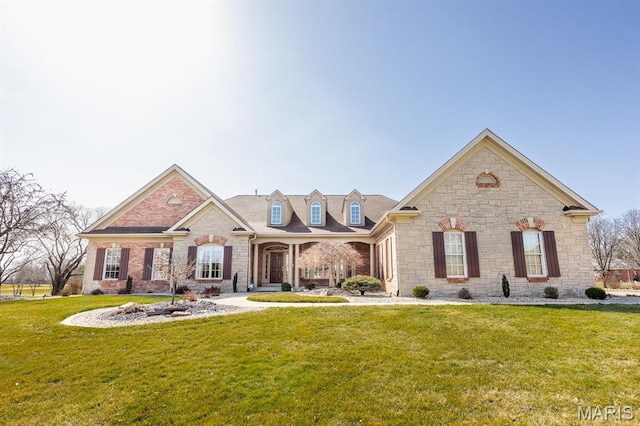 view of front of house featuring stone siding and a front lawn