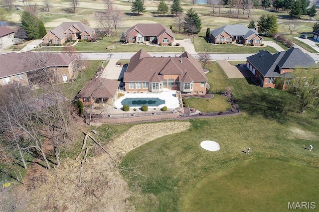 aerial overview of property's location with nearby suburban area