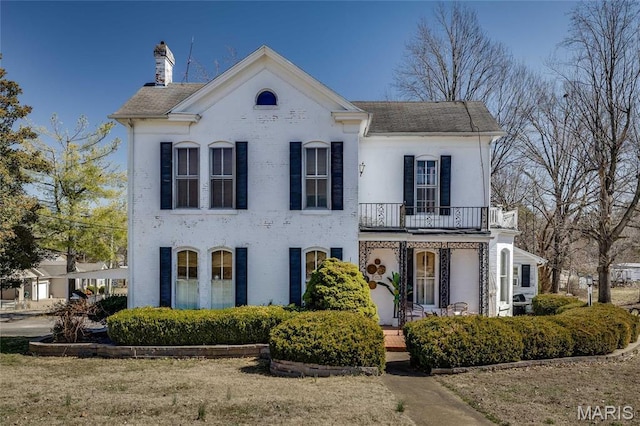 401 S Main, Fredericktown, MO 63645 - view of front of property with a balcony, a chimney, a porch, and roof with shingles