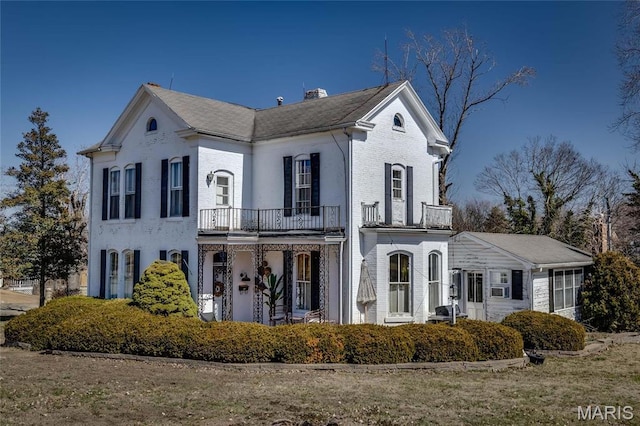 401 S Main, Fredericktown, MO 63645 - view of front of house featuring a balcony, brick siding, and a chimney