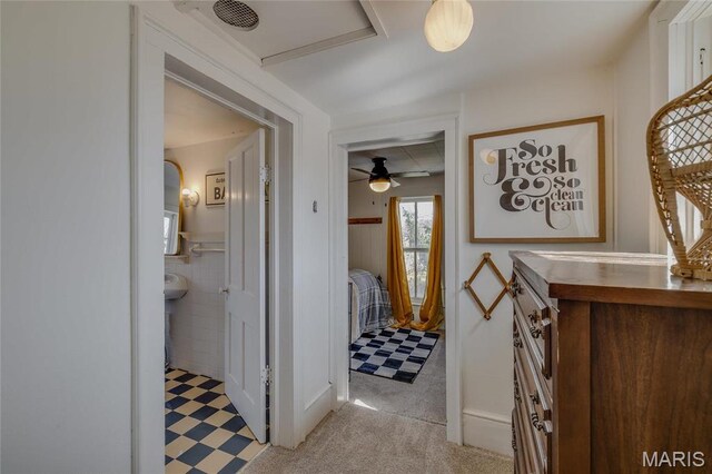401 S Main, Fredericktown, MO 63645 - hallway featuring light flooring, attic access, and a wainscoted wall