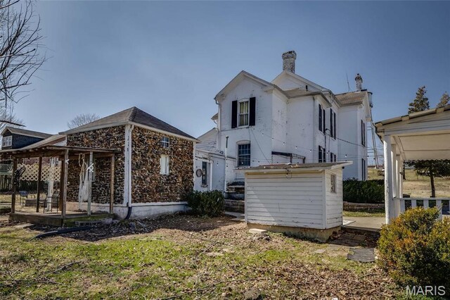 401 S Main, Fredericktown, MO 63645 - rear view of house with a chimney