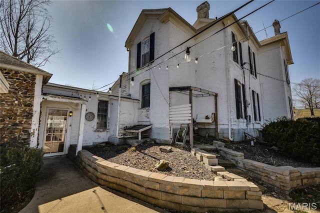 401 S Main, Fredericktown, MO 63645 - view of property exterior with a chimney and brick siding