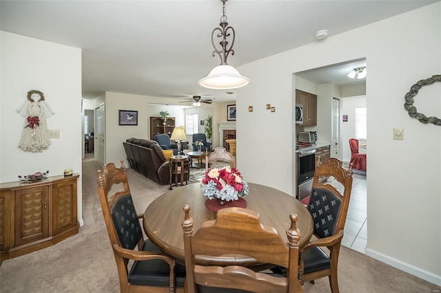 1611 Walpole Dr Unit C, Chesterfield, MO 63017 - dining room with a ceiling fan, plenty of natural light, light carpet, and a fireplace