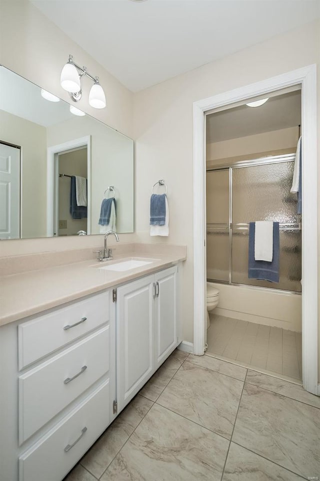 1611 Walpole Dr Unit C, Chesterfield, MO 63017 - bathroom with marble finish floors, vanity, toilet, and bath / shower combo with glass door