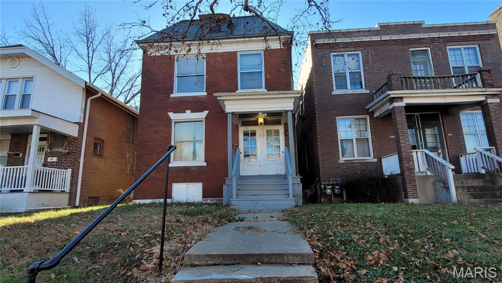 5052 Northland Ave, Saint Louis, MO 63113 - view of front of house featuring brick siding