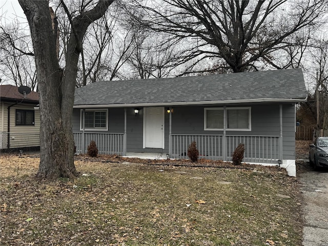10533 Earl Dr, Saint Louis, MO 63136 - ranch-style home with a porch, a shingled roof, and fence