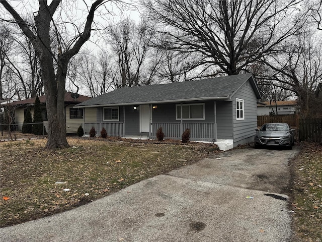 10533 Earl Dr, Saint Louis, MO 63136 - single story home featuring a porch, fence, driveway, and roof with shingles