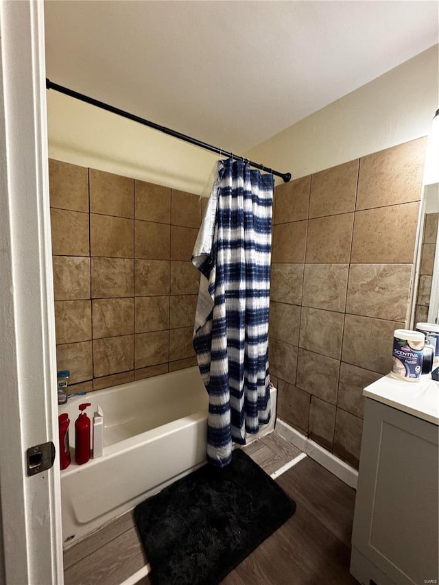 10533 Earl Dr, Saint Louis, MO 63136 - bathroom with wood finished floors, shower / tub combo, and vanity
