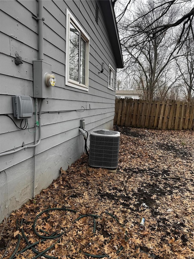 10533 Earl Dr, Saint Louis, MO 63136 - view of side of property with central AC unit and fence