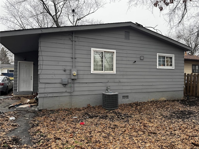 10533 Earl Dr, Saint Louis, MO 63136 - view of home's exterior with cooling unit, crawl space, and fence