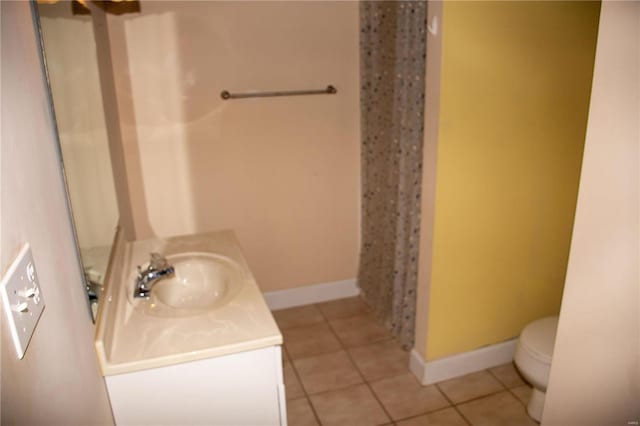full bath featuring vanity, tile patterned floors, baseboards, toilet, and a shower with shower curtain