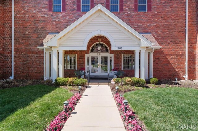 561 Sarah Ln Unit 305, Saint Louis, MO 63141 - entrance to property with french doors, a lawn, and brick siding
