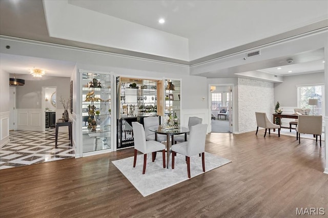 561 Sarah Ln Unit 305, Saint Louis, MO 63141 - dining room with a decorative wall, wainscoting, and wood finished floors