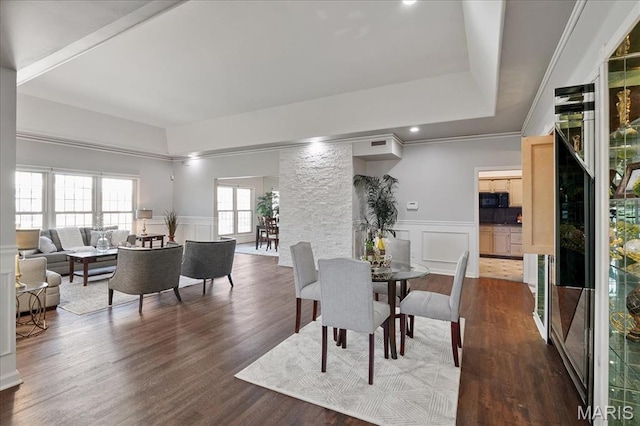 561 Sarah Ln Unit 305, Saint Louis, MO 63141 - dining space with a decorative wall, a wainscoted wall, and dark wood-style flooring
