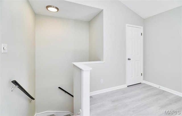 9167 Robin Ct, Saint Louis, MO 63144 - stairway with wood finished floors, baseboards, and vaulted ceiling