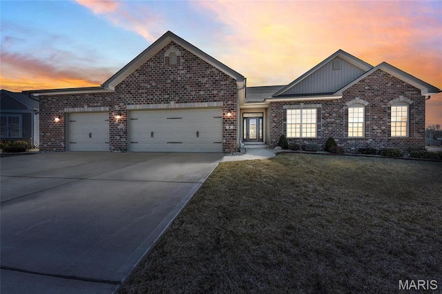 2 Wyndemere Ct, Lake St Louis, MO 63367 - view of front of house featuring an attached garage, brick siding, driveway, and board and batten siding