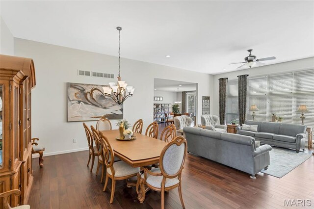 2 Wyndemere Ct, Lake St Louis, MO 63367 - dining space featuring a chandelier, dark wood finished floors, a ceiling fan, baseboards, and recessed lighting