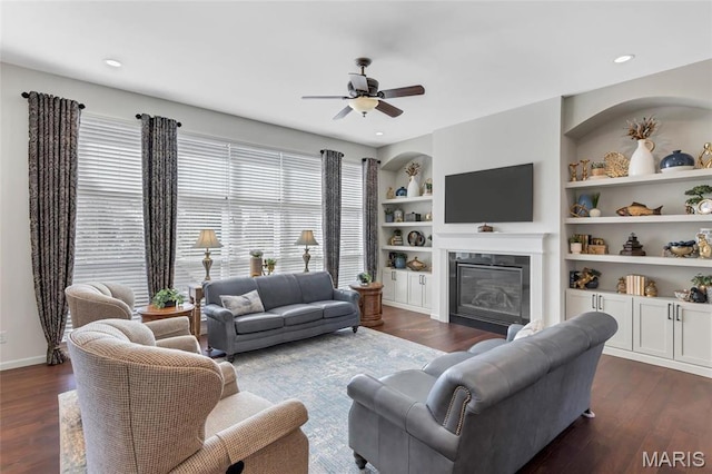 2 Wyndemere Ct, Lake St Louis, MO 63367 - living room featuring dark wood-style flooring, ceiling fan, a glass covered fireplace, and recessed lighting