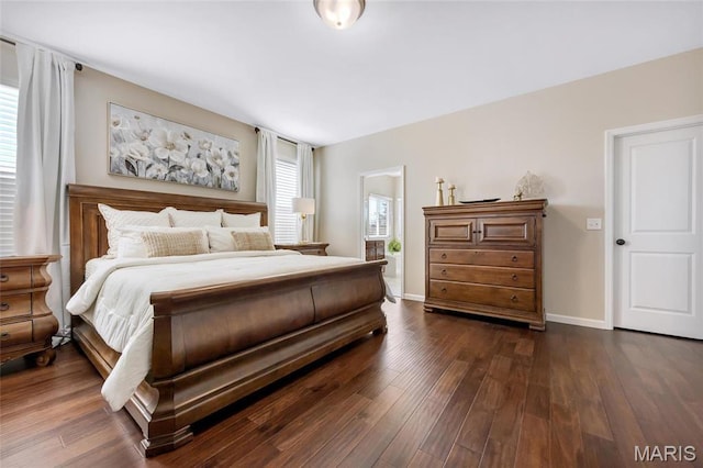 2 Wyndemere Ct, Lake St Louis, MO 63367 - bedroom with dark wood-style flooring and baseboards