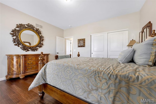 2 Wyndemere Ct, Lake St Louis, MO 63367 - bedroom featuring a closet, dark wood-type flooring, and baseboards