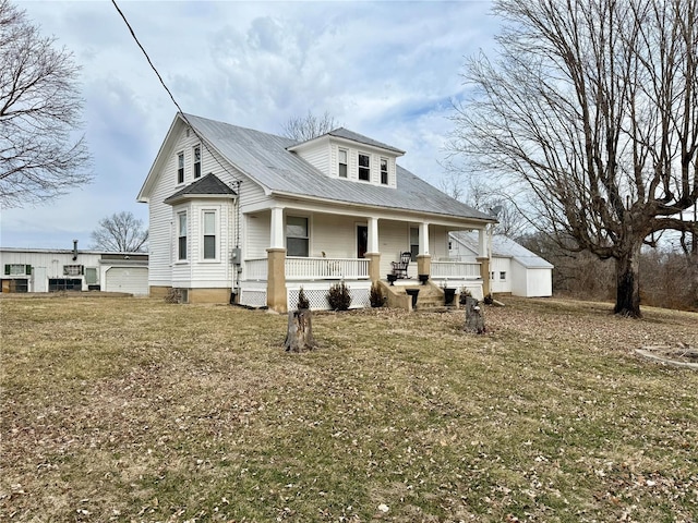 view of front facade with covered porch and a front lawn