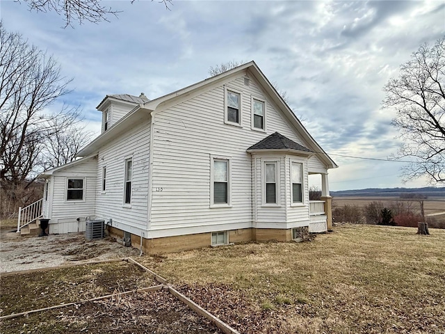 view of side of property with cooling unit