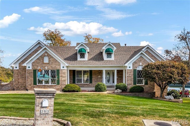263 Ashdown Forest Ct, Weldon Spring, MO 63304 - view of front of property with a front yard, brick siding, and roof with shingles