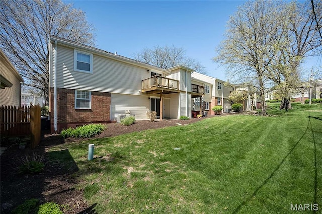 back of property featuring brick siding