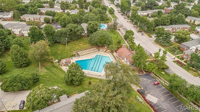 aerial view of property and surrounding area featuring a pool
