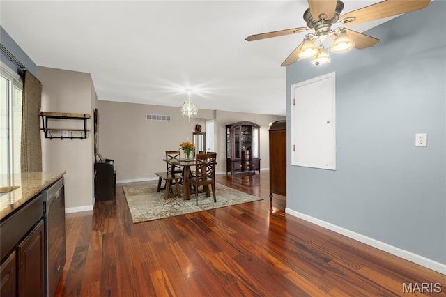 944 Millwood Dr, Saint Peters, MO 63376 - dining room featuring dark wood-style floors, arched walkways, baseboards, and a ceiling fan