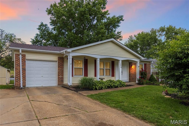 944 Millwood Dr, Saint Peters, MO 63376 - view of front facade featuring driveway, covered porch, brick siding, an attached garage, and a front yard