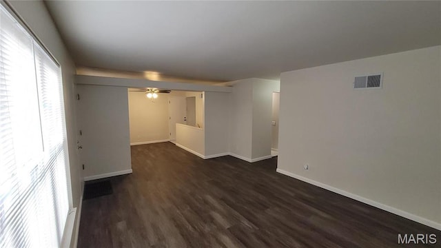 10216 Pannell Dr, Saint Louis, MO 63136 - empty room featuring dark wood-type flooring, baseboards, and ceiling fan