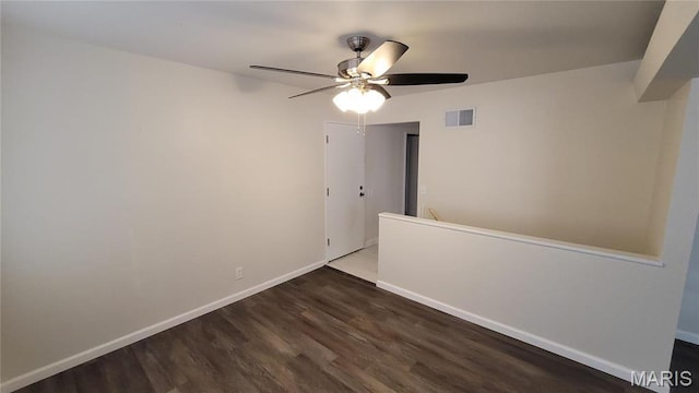 10216 Pannell Dr, Saint Louis, MO 63136 - empty room with wood finished floors, a ceiling fan, and baseboards