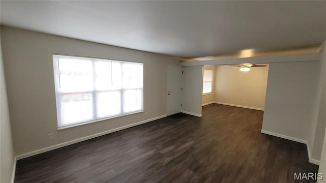 10216 Pannell Dr, Saint Louis, MO 63136 - empty room with dark wood-type flooring, baseboards, and ceiling fan
