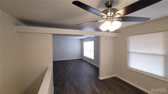 10216 Pannell Dr, Saint Louis, MO 63136 - empty room featuring baseboards, dark wood-style floors, and a ceiling fan